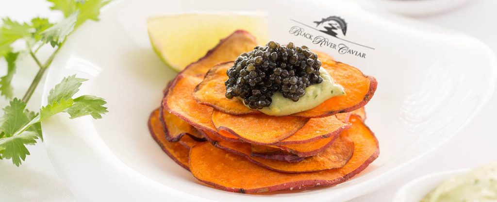 Potato tower topped with lime cream and caviar