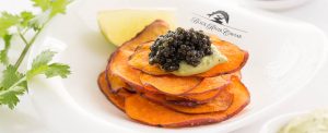 Potato tower topped with lime cream and caviar