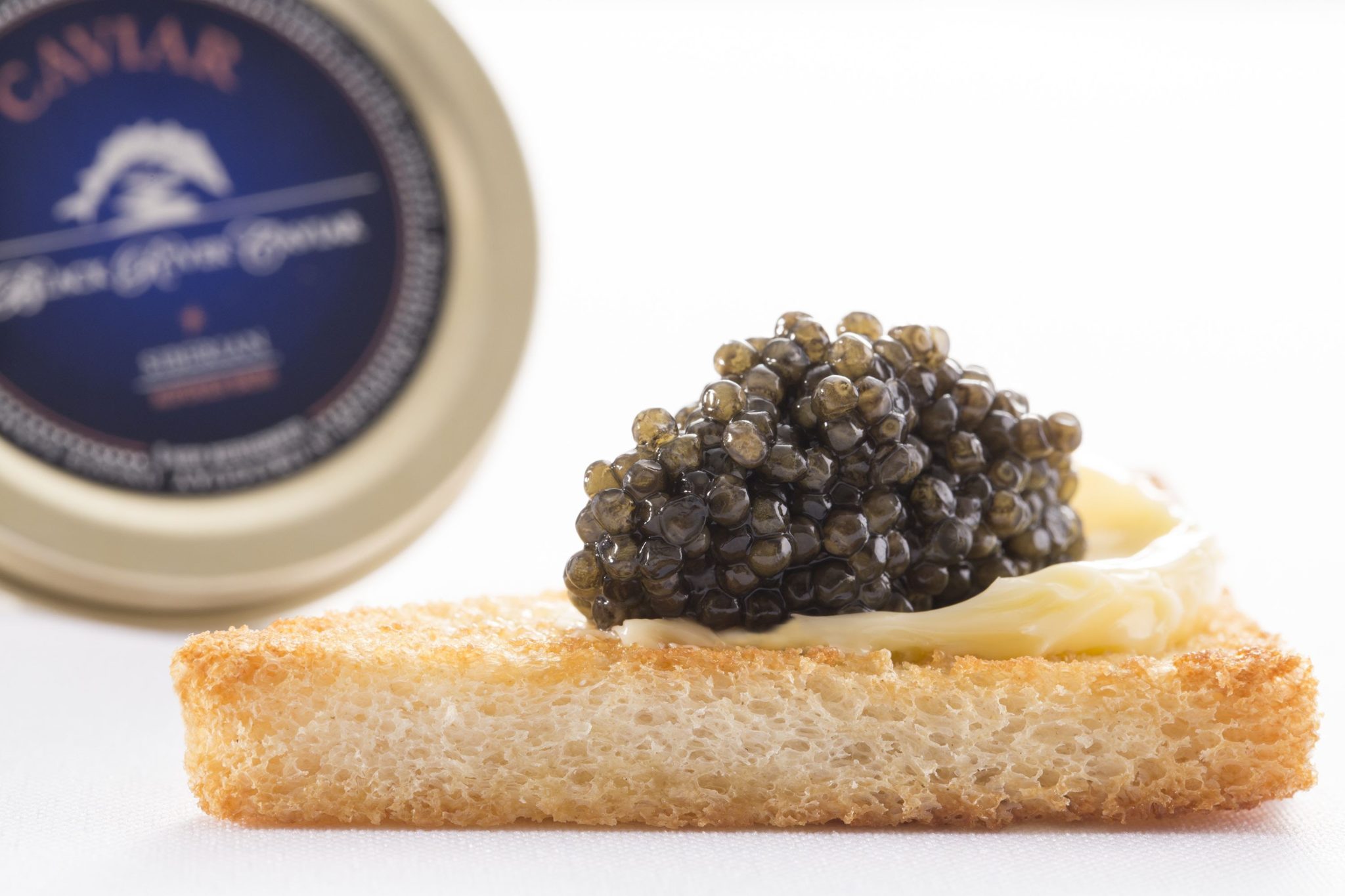 Mini toasts with butter and caviar - Black River Caviar